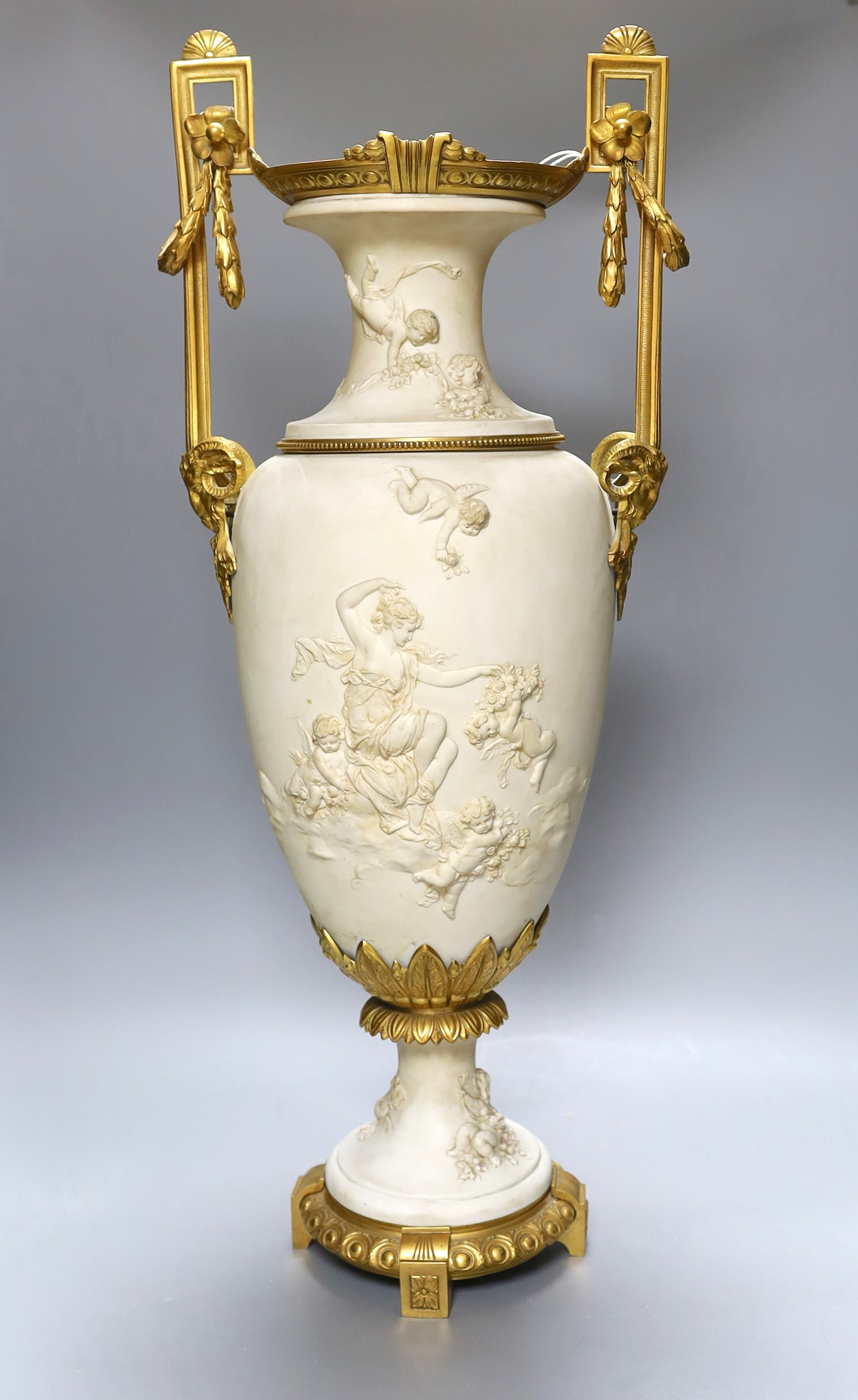 A large Louis XVI style ormolu mounted biscuit porcelain urn - 63cm tall
